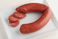 Turkish sausage sucuk on a white dish