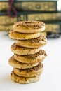 Turkish Sesame Rings Kandil Simidi stacked on the white surface In front of the blurred scripture Royalty Free Stock Photo