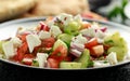 Turkish Shepards Salad with cucumber, tomato, red onion, pepper, parsley pita bread and Feta cheese Royalty Free Stock Photo