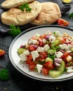 Turkish Shepards Salad with cucumber, tomato, red onion, pepper, parsley pita bread and Feta cheese Royalty Free Stock Photo