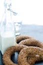 Turkish simit bagels and a bottle of milk on a black background