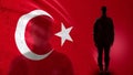 Turkish soldier silhouette standing against national flag, proud army sergeant