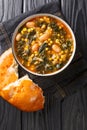 Turkish soup lahana corbasÃÂ± Tarifi turkish soup with kale, beans and corn close-up in a bowl. vertical top view Royalty Free Stock Photo