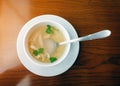 Deliicous hot chicken soup in bowl on wooden table Royalty Free Stock Photo