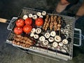 Turkish Style Lamb Kebab Shish Skewer Cooked with Mushrooms and Roasted Tomatoes on Street Barbecue Mangal Royalty Free Stock Photo