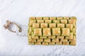 Turkish sweet Dry Baklava on a marble background. Turkish pastry dessert baklava. Ramadan or holiday desserts concept. Antep