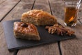 Turkish sweets baklava with tea nuts and cinnamon Royalty Free Stock Photo