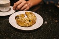 Turkish sweets - sweet bagel with filling sprinkled with pieces of nuts Royalty Free Stock Photo