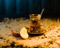 Turkish tea with apple slices oriental theme in warm cold light