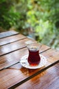 Turkish tea. Black tea in a national Turkish cup. Glass of Armudu. Royalty Free Stock Photo