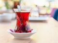 Turkish tea cup and classic tea cup mat on wooden table Royalty Free Stock Photo