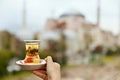 Turkish Tea Drink In Traditional Glass Cup In Hand Royalty Free Stock Photo