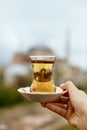 Turkish Tea Drink In Traditional Glass Cup In Hand Royalty Free Stock Photo