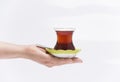 Turkish tea in female hands