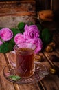 Turkish tea in a glass cup and dried dates fruits on wooden background. Ramadan food. Selective focus Royalty Free Stock Photo