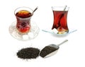 Turkish tea in traditional glasses and dry black tea leaves isolated on white background