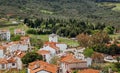 Turkish town view. Green hills, rural landscape and old windmill on Island Cunda. Beautiful village scene Royalty Free Stock Photo