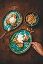 Human hand cutting Turkish pumpkin dessert with walnuts and cream Royalty Free Stock Photo