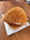 Turkish Utu Tost / Toast Sandwich on Wooden Table Surface. Street Food