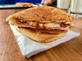 Turkish Utu Tost / Toast Sandwich on Wooden Table Surface. Street Food