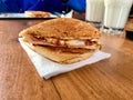 Turkish Utu Tost / Toast Sandwich on Wooden Table Surface. Street Food