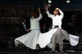 The Turkish whirling dancers or Sufi whirling dancers at Spirito Del Pianeta Royalty Free Stock Photo