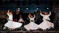 The Turkish whirling dancers or Sufi whirling dancers at Spirito Del Pianeta Royalty Free Stock Photo