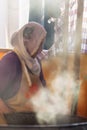 Turkish woman cooking traditional food at bazaar