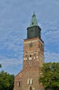 Turku Cathedral against a blue cloudy sky. Royalty Free Stock Photo