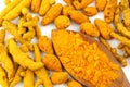 Turmeric barks with spoon of turmeric powder