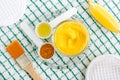 Turmeric and greek yogurt sour cream or kefir facial mask with lemon and olive oil. Homemade beauty treatments recipe. Royalty Free Stock Photo