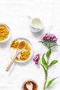 Turmeric, honey, coconut milk face mask. Homemade ingredients beauty products on a light background, top view. Beauty, skin care Royalty Free Stock Photo
