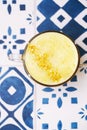 Turmeric latte or golden milk with glitter stars Royalty Free Stock Photo