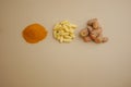 Turmeric powder, capsules, and fresh turmeric root on color background Royalty Free Stock Photo