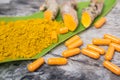 Turmeric powder ,capsules , roots and leaf, curcumin herb medicine Royalty Free Stock Photo