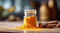 Turmeric powder in a glass jar on a wooden table Royalty Free Stock Photo