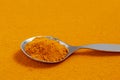 Turmeric powder is orange in color. Natural, useful healing spice from the East. Curcuma