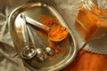 Turmeric powder spice in jar and measuring spoons Royalty Free Stock Photo