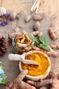 Turmeric powder with tumeric capsules for health. Royalty Free Stock Photo