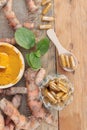 Turmeric powder with tumeric capsules for health. Royalty Free Stock Photo