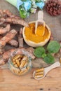 Turmeric powder with tumeric capsules for health. Royalty Free Stock Photo