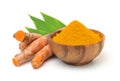 Turmeric powder in a wooden bowl and turmeric (curcumin) rhizomes isolated on a white background.