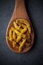 Turmeric rhizome on a wooden spoon Royalty Free Stock Photo