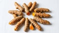 Rhizomes Curcuma longa arranged in a circular pattern on a white Royalty Free Stock Photo