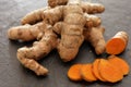 Turmeric rhizomes on a slate cutting board