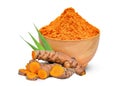 Turmeric root and turmeric powder in the wood bowl