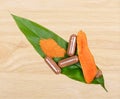 Turmeric Root Powder on wood, Curcuma Root, Turmeric Capsule on Leaf; white background.Herb high vitamin C