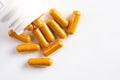 Turmeric Root Supplements Spilled from a Bottle