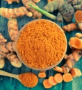 Turmeric roots in the basket on wooden table Royalty Free Stock Photo