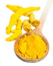 Turmeric roots and powder on wooden spoon Royalty Free Stock Photo